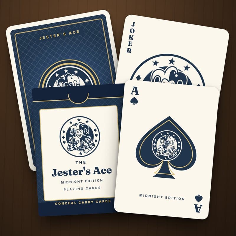 The Jester's Ace Midnight Edition deck: a navy tuck box, a navy-and-gold card back with a jester medallion, the Ace of Spades and the Jester Joker